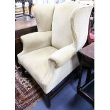 A George III design upholstered wing armchair