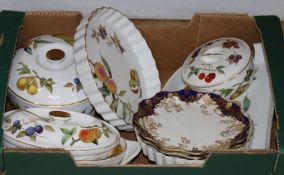 A quantity of Worcester Evesham dinner ware and a pair of Doulton porcelain plates