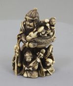 A Japanese ivory netsuke of Bishamon Ten, Meiji period, standing and holding a miniature of the Gods