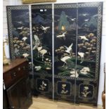 An Oriental four fold lacquer screen W.162cm