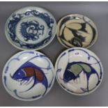 Three Chinese blue and white fish dishes and a similar dragon dish