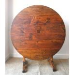 A 19th century French Vendange dining table in pine, cherry and oak Diameter 100cm