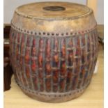A carved faux bamboo tribal drum