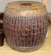 A carved faux bamboo tribal drum