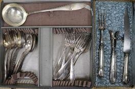 A cased French white metal handled carving set and a plated canteen