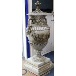 A pair of reconstituted stone Neo-Classical two handled campana shaped lidded urns, on plinths H.