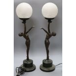 A pair of Art Deco style bronzed metal table lamps, the bases formed as female nudes with