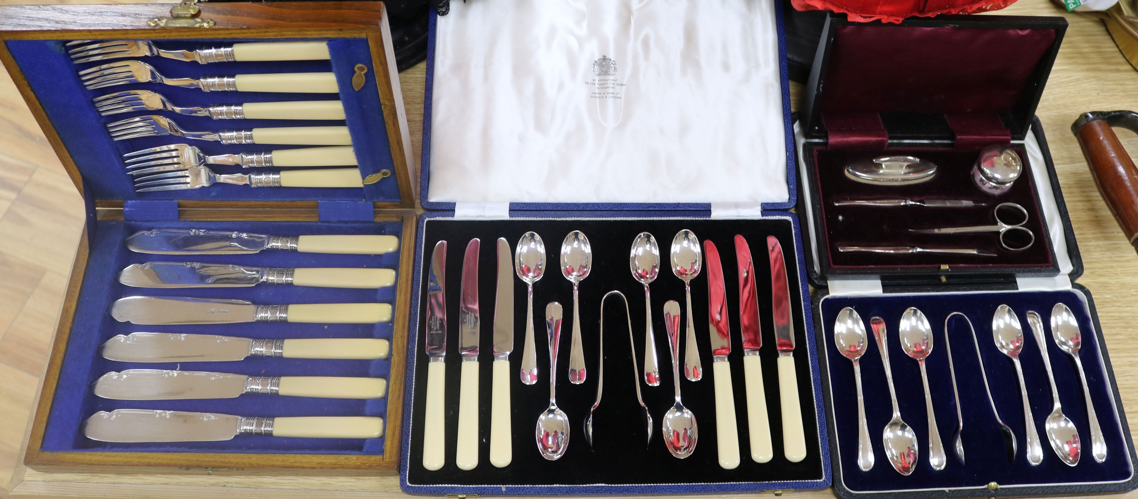 A silver manicure set and mixed plated cutlery