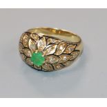 A yellow metal, emerald, diamond and black enamel domed top dress ring, size M/N.