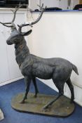 A large bronzed metal model of a standing stag H.154cm