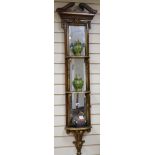 A narrow mirrored giltwood three tier wall bracket, a pair of lidded cloisonne vases and a painted