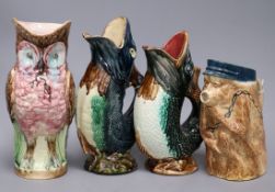 Two ceramic fish jugs, one owl and a monkey