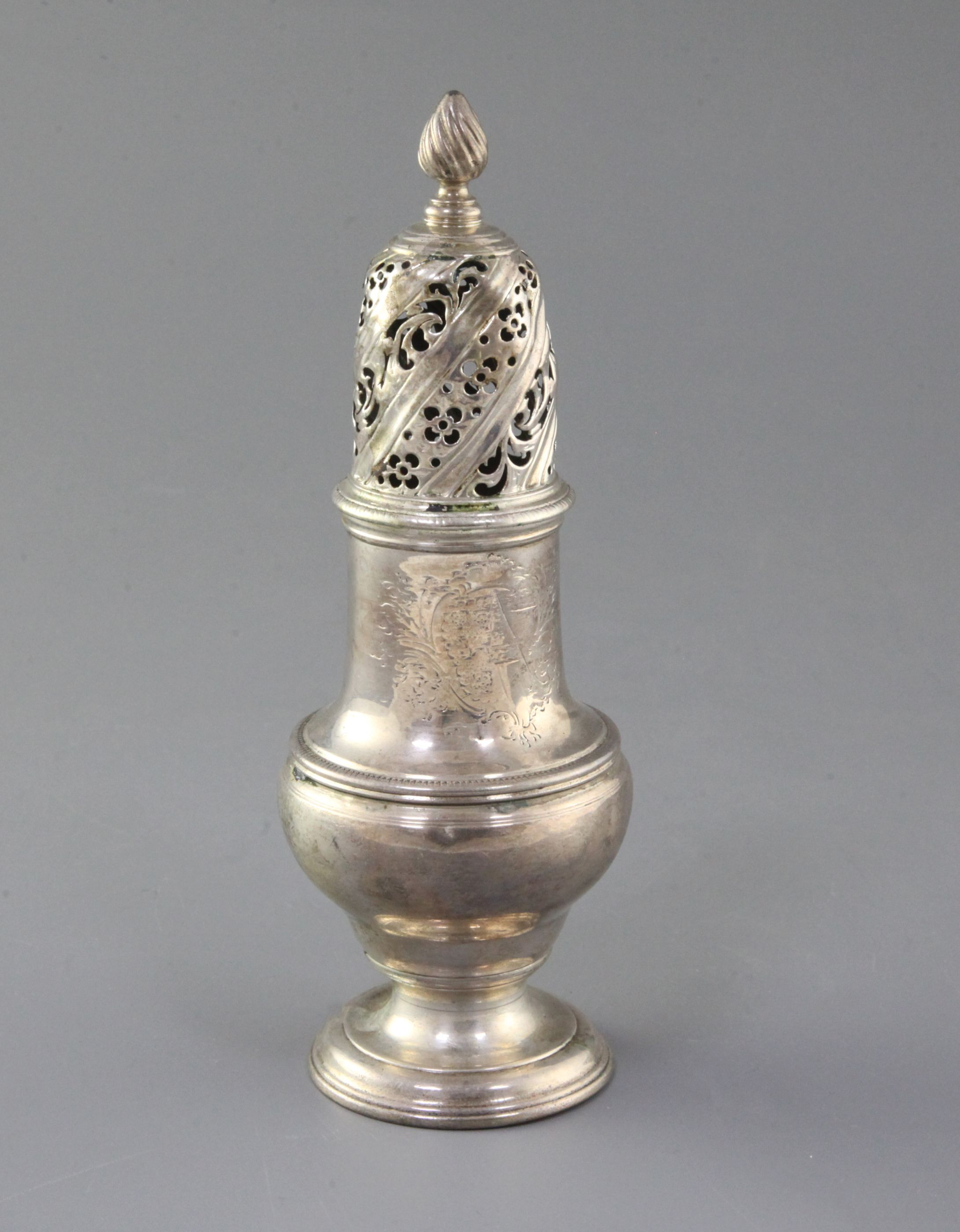 A George II silver caster by Samuel Wood, engraved with the Heneage family crest, of baluster