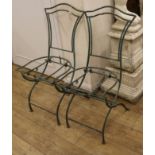 A pair of French metal folding chairs