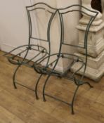 A pair of French metal folding chairs