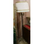 A brass three light standard lamp W.37cm