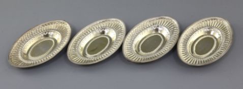 A set of four George III embossed silver gilt oval nut dishes by John Emes, London, 1799, 13cm, 8