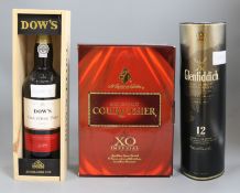 A boxed Courvoisier XO Cognac, a bottle of Dow's Christmas port and a Glenfiddich 12 year malt