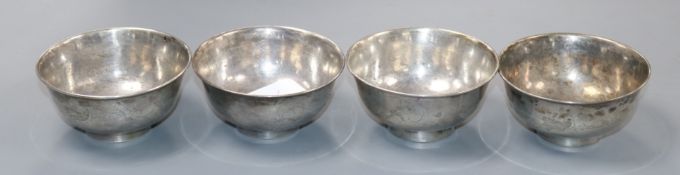 A set of four Chinese white metal bowls, diameter 8.5cm.