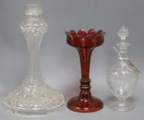 An Edwardian 'rock crystal' glass decanter, a ruby glass lustre and a cut glass lamp base