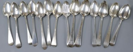Fourteen assorted Georgian and Victorian silver table spoons 26 oz.
