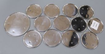 A modern set of twelve heavy silver coasters and a large matching coaster, largest 11.5cm, gross