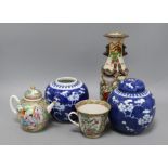 A Chinese famille rose teapot, cup, vase and two Chinese blue and white jars and one cover tallest