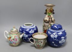 A Chinese famille rose teapot, cup, vase and two Chinese blue and white jars and one cover tallest