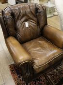 A Pegasus brown leather armchair