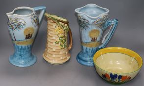 A Clarice Cliff Bizarre crocus bowl, a pair of Wadeheath jugs and a Myott jug
