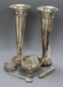 A pair of silver trumpet-shaped specimen vases, London 1912, William Comyns (weighted) and seven