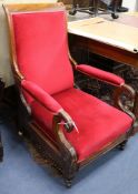 A William IV mahogany open armchair with sliding footrest