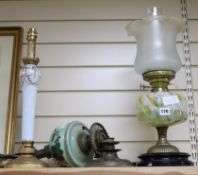 Two early 20th century oil lamps and another lamp