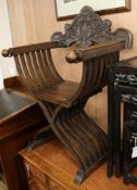 A 'Savonarola' carved walnut armchair W.72cm