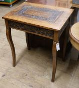 A carved oak table W.61cm