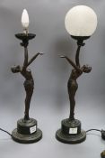 A pair of Art Deco style bronzed metal table lamps, the bases formed as female nudes with