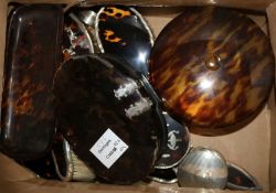 A silver and tortoiseshell harlequin dressing table set with related jars, dishes, etc.