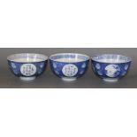 A set of three Chinese blue and white bowls, c.1910