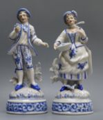 A pair of German porcelain figures height 19cm