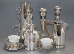 A pair of 925 candlesticks, pair of 900 silver tea cups and saucers and three plated items