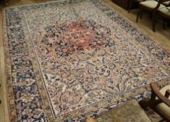 A Persian red ground carpet with pole medallion 372 x 255cm