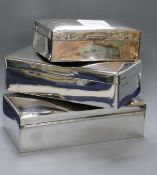 Three assorted silver cigarette boxes, largest 19cm.
