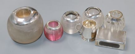 Five assorted silver mounted glass match tidies, a silver matchbox sleeve and a miniature silver