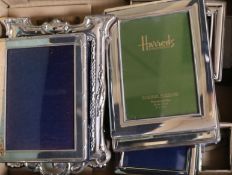Eight assorted modern silver mounted photograph frames of varying sizes, largest 18.7cm.