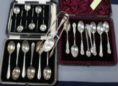 Three cased sets of silver spoons, a pair of silver sugar tongs and a silver teaspoons.