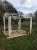 A large white painted wrought iron gazebo This lot may be viewed on site at a property at Pett,