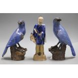 A pair of Chinese blue glazed figures of hawks and a similer figure