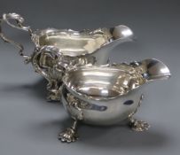A pair of late Victorian silver sauceboats by Nathan & Hayes, Chester 1897/8, height 11cm, 21 oz.