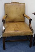 A mahogany and tan leather Gainsborough chair, 67cm