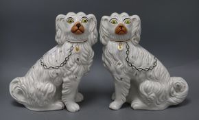 A pair of Staffordshire Spaniels height 26cm